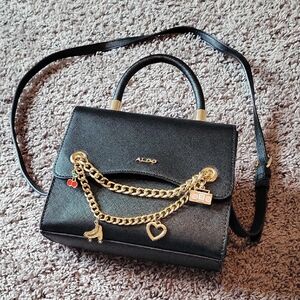 Aldo Black Crossbody Bag with Gold Chain and Charms